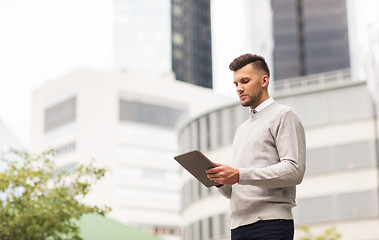 Image showing man with tablet pc computer in city