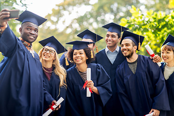 Image showing students or bachelors taking selfie by smartphone