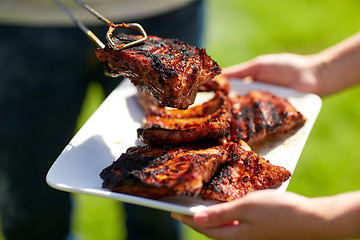 Image showing man cooking meat at summer party barbecue