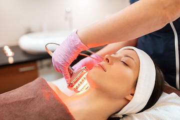 Image showing young woman having face microdermabrasion at spa