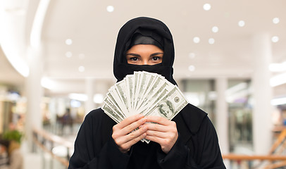 Image showing muslim woman in hijab with money over white