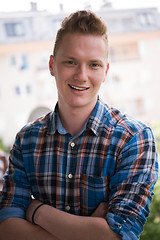 Image showing man standing at balcony