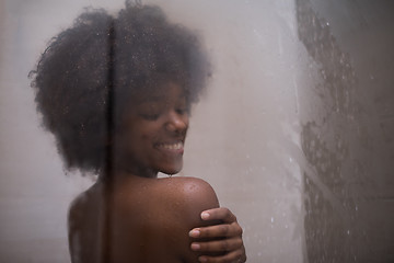 Image showing African American woman in the shower