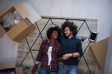 Image showing Top view of attractive young multiethnic couple