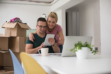 Image showing Young couple moving in a new home