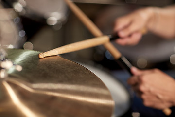 Image showing male musician playing drums and cymbals at concert