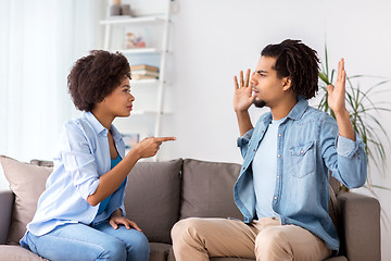 Image showing unhappy couple having argument at home