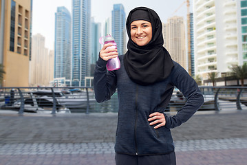 Image showing muslim woman with water bottle doing sport