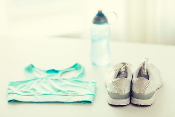 Image showing close up of female sports clothing and bottle set