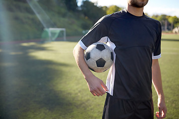 Image showing close up of soccer player with football on field