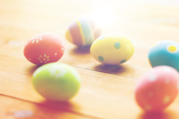 Image showing close up of colored easter eggs on wooden surface