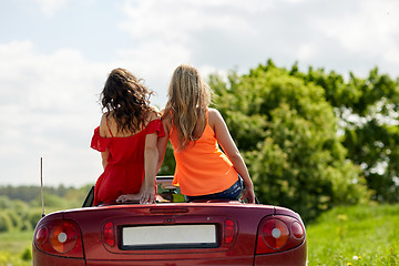 Image showing friends driving in convertible car at summer 