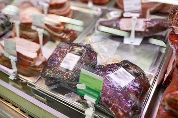 Image showing ham at grocery store stall