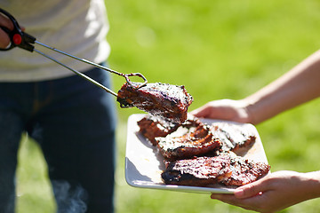 Image showing man cooking meat at summer party barbecue