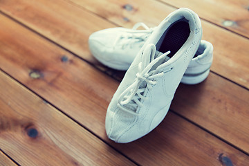 Image showing close up of sneakers on wooden floor