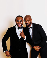 Image showing two afro-american businessmen in black suits emotional posing, g