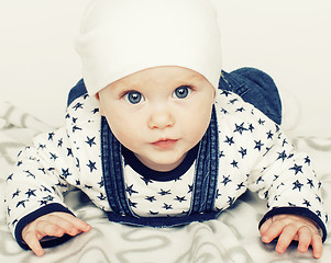 Image showing little cute baby toddler on carpet isolated close up smiling ado