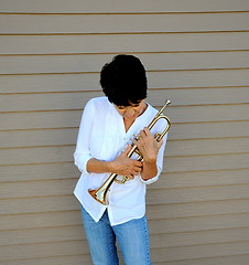 Image showing Female trumpet player.