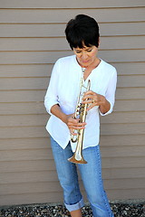 Image showing Female trumpet player.