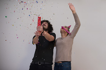 Image showing romantic young  couple celebrating  party with confetti