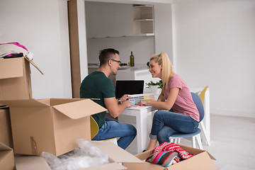 Image showing Young couple moving in a new home