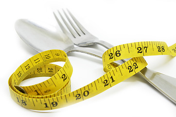 Image showing Steel spoon a fork and measuring tape