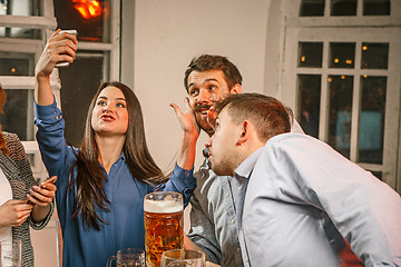 Image showing Group of friends girls making selfie photo