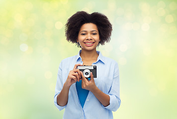 Image showing happy african american woman with film camera