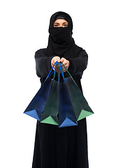 Image showing muslim woman in hijab with shopping bags