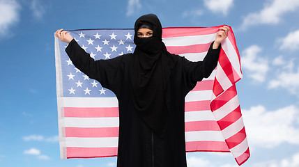 Image showing muslim woman in hijab with american flag
