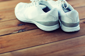 Image showing close up of sneakers on wooden floor