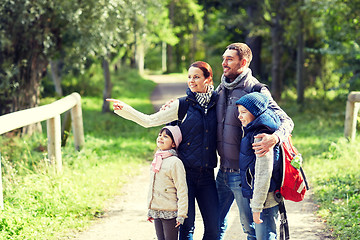 Image showing happy family with backpacks hiking