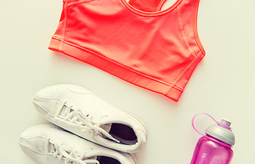 Image showing close up of female sports clothing and bottle set