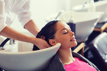 Image showing happy young woman at hair salon