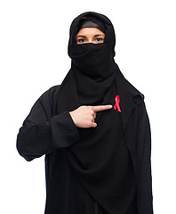 Image showing muslim woman in hijab with red awareness ribbon