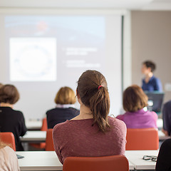 Image showing Woman giving presentation in lecture hall at university.