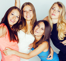 Image showing group of many cool modern girls friends in bright clothers together having fun isolated on white background, happy smiling lifestyle people concept