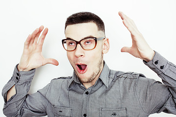 Image showing young handsome well-groomed guy posing emotional on white background, lifestyle people concept