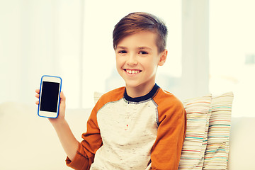 Image showing smiling boy with smartphone at home