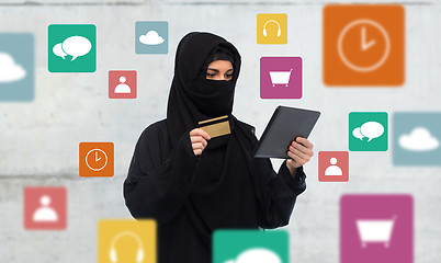 Image showing woman in hijab with tablet pc and credit card