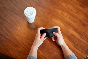 Image showing close up of woman with smartphone and coffee