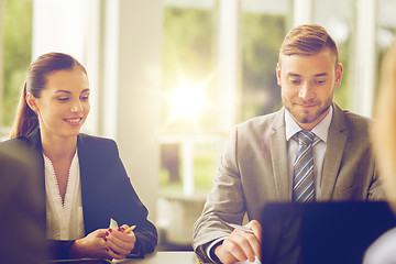 Image showing smiling business people meeting in office