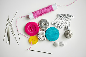 Image showing sewing buttons, needles, pins and thread spool