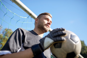 Image showing goalkeeper with ball at football goal on field