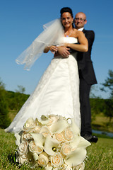 Image showing Wedding bouquet and couple