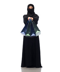 Image showing muslim woman in hijab with shopping bags