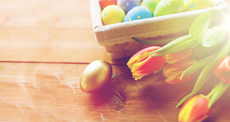 Image showing close up of colored easter eggs and flowers