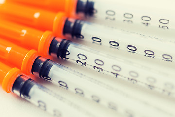 Image showing close up of insulin syringes on table