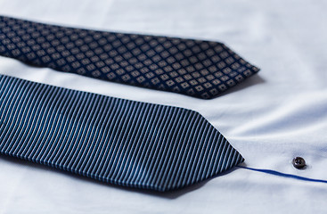 Image showing close up of shirt and blue patterned ties