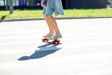 Image showing teenage boy on skateboard crossing city crosswalk